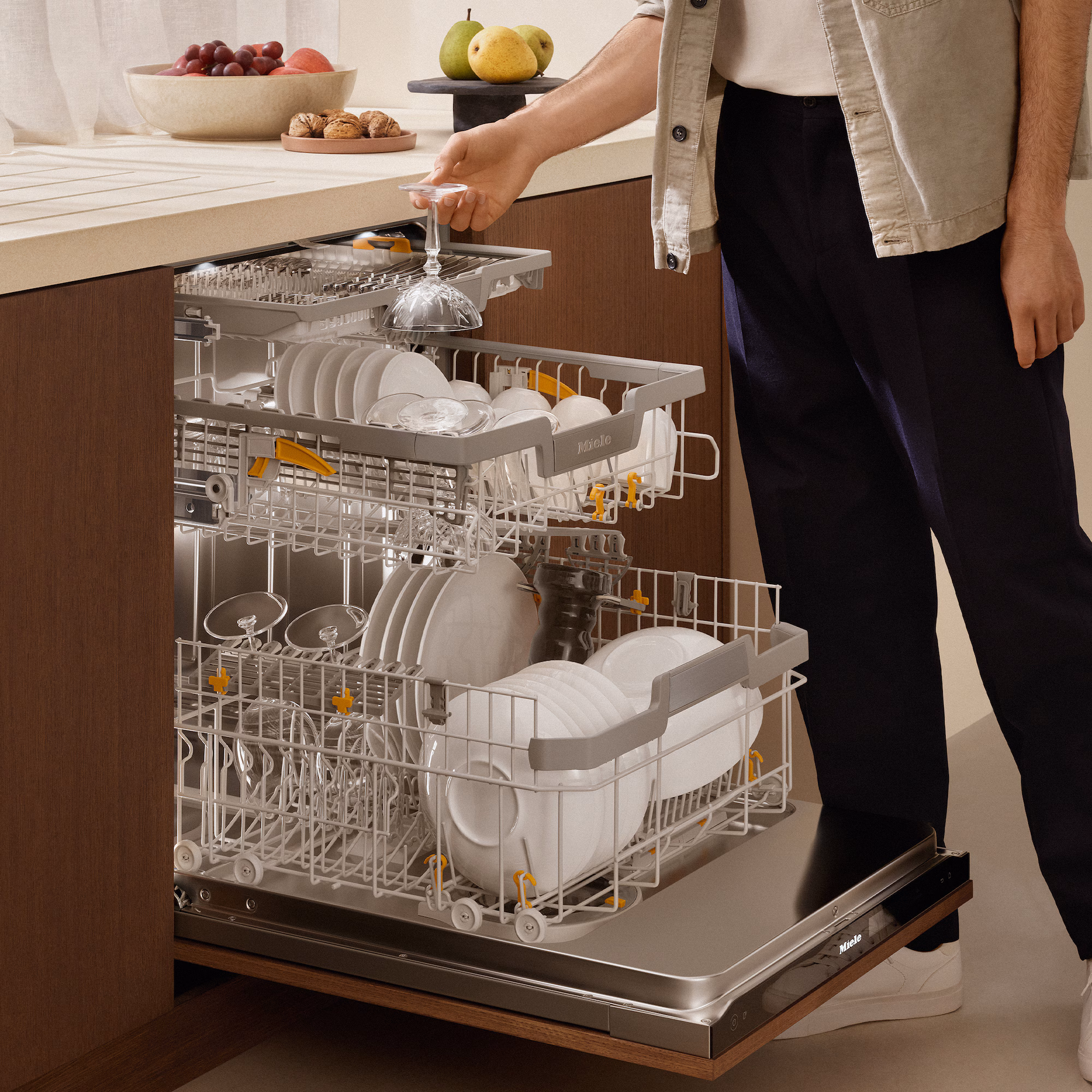 Dishwasher interior with bottle jets cleaning a water bottle